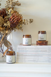 Love and Peace, Calming and Intuition, and Revitalise and Cleanse candles displayed together in a lifestyle setting, radiating a harmonious blend of serenity, clarity and emotional balance.