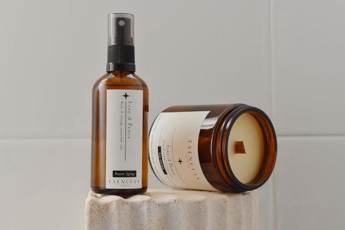 Love and Peace candle and room spray displayed in a product-focused image, emphasising their sleek design and calming, nurturing energy.