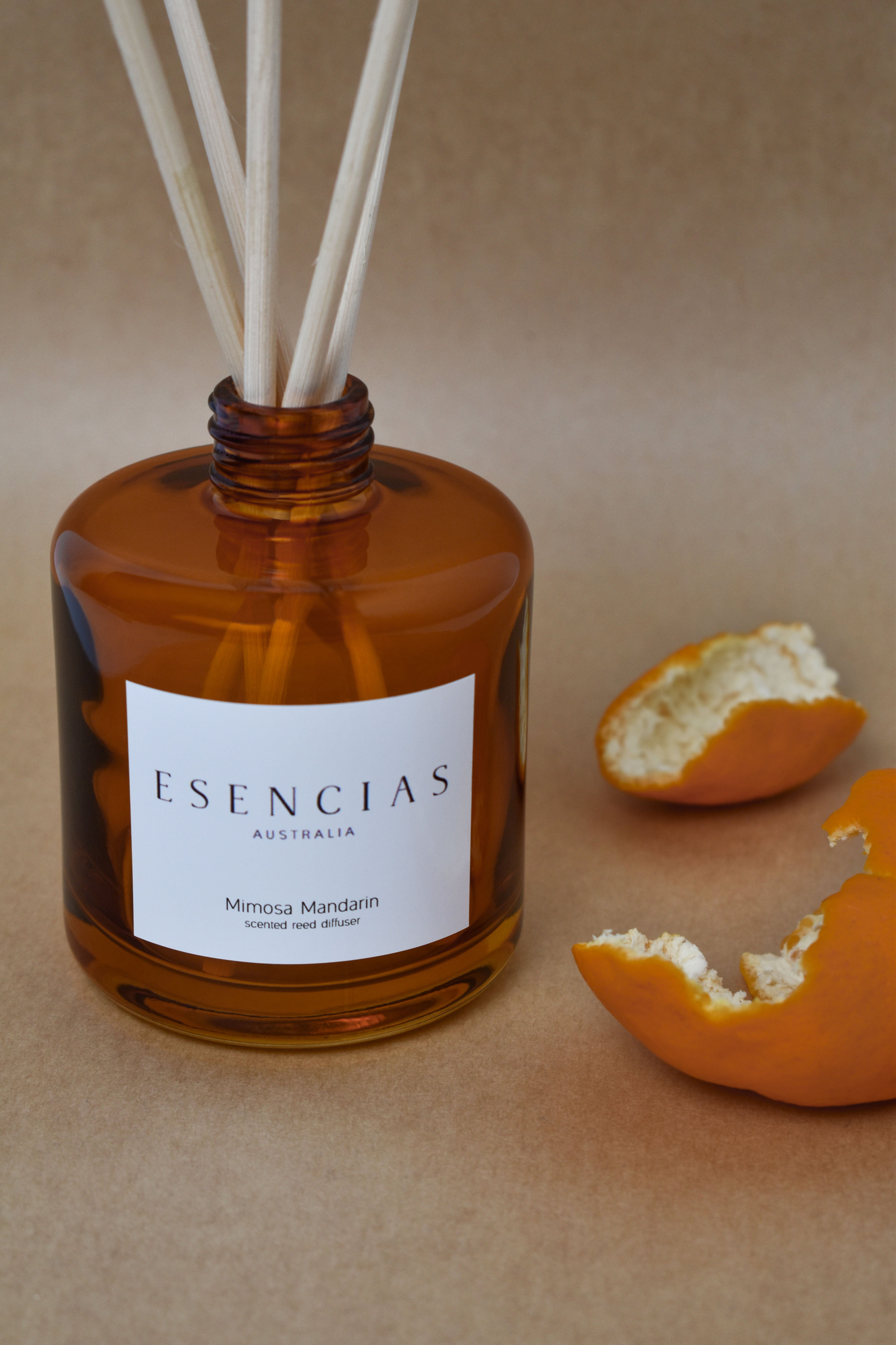 Mimosa Mandarin reed diffuser in amber jar shown in a clean product-focused image, highlighting its elegant design and fresh, uplifting scent.