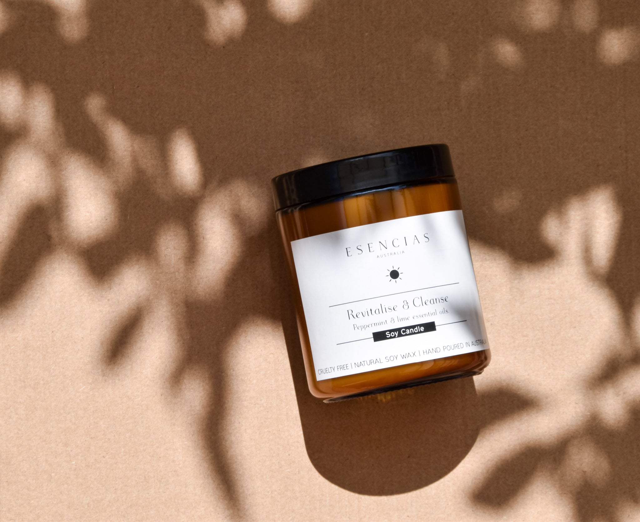 Revitalise and Cleanse soy candle in an amber jar, showcased in a product-focused image highlighting its soothing and refreshing qualities.