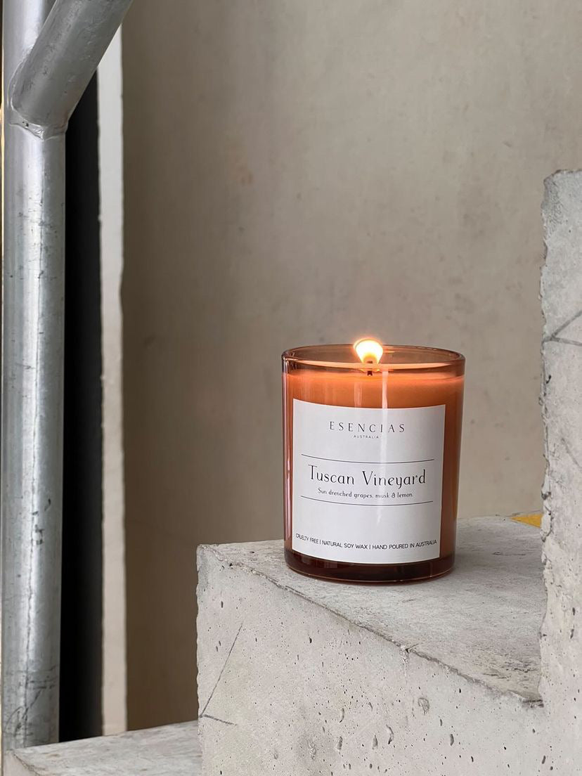 Tuscan Vineyard candle in signature amber jar displayed in a clean, product-focused image highlighting its elegant design and rich tones.