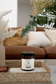 Angelic Radiance Soy Candle styled in living room product shot. 