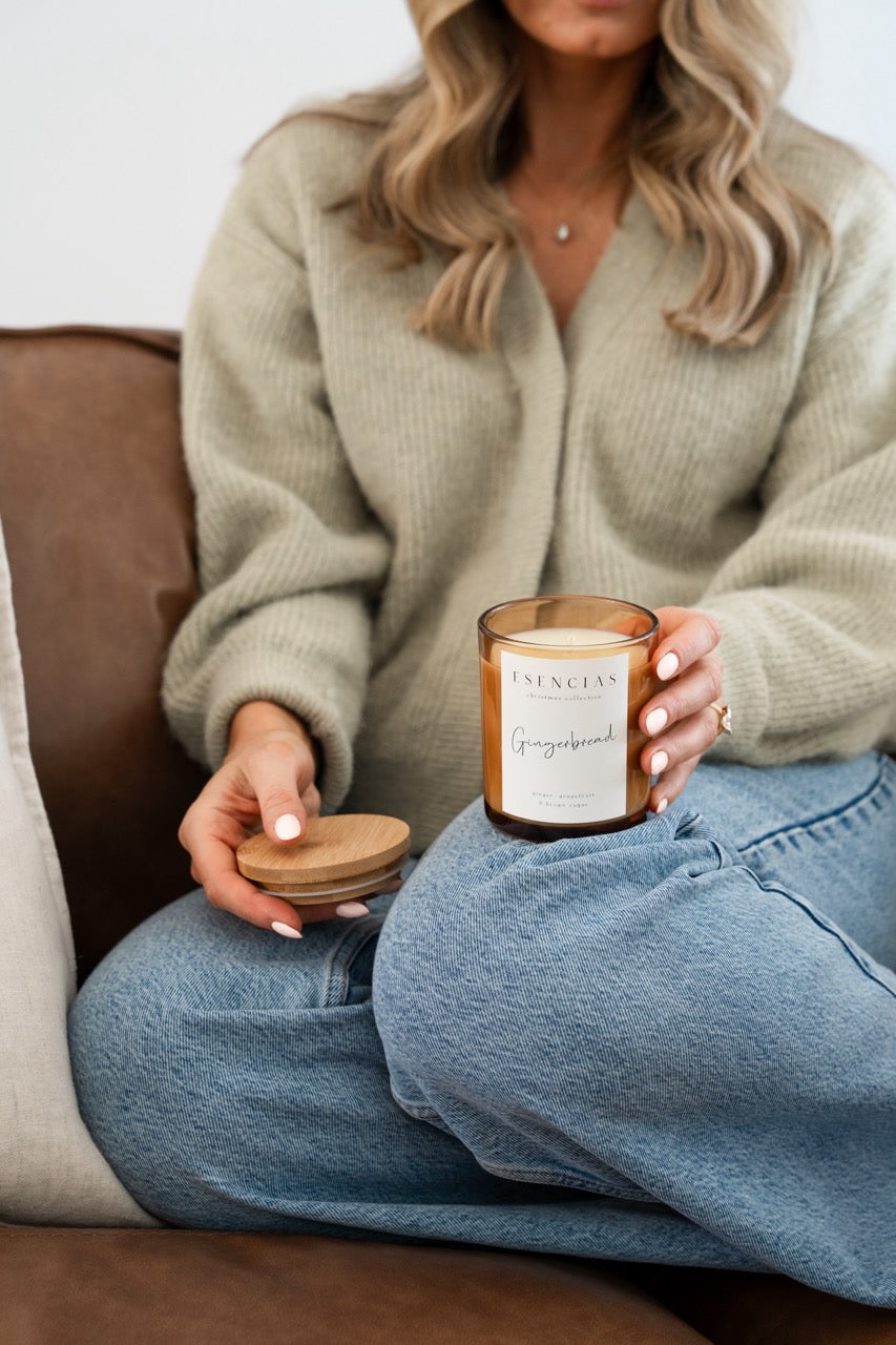 Christmas Range Gingerbread held by model with timber lid off showing lovely creamy wax inside. 