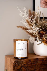 Christmas Range Gingerbread styled on timber shelf and flowers. 