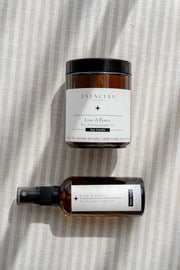 Love & Peace Soy Candle & Room Spray styled together simply. 