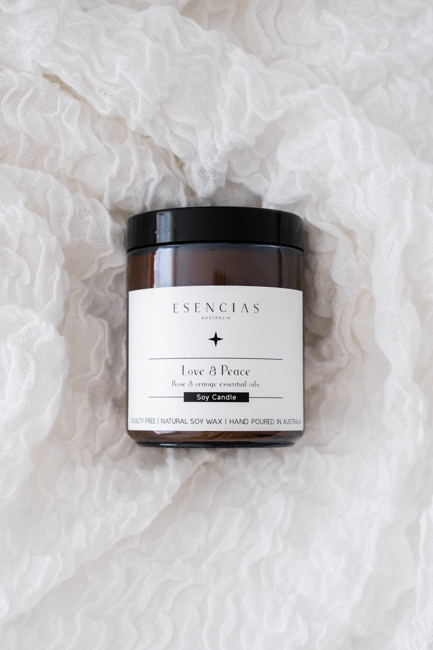 Love and Peace soy candle on a textured white background