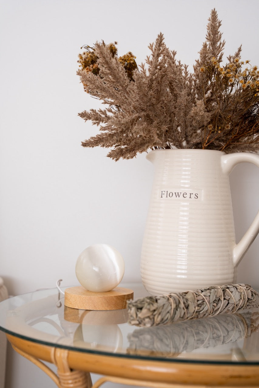 Selenite Sphere & White Sage styled with flowers 