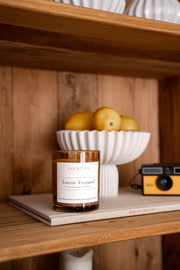 Signature Soy Candle Tuscan Vineyard in lifestyle image on shelf. 