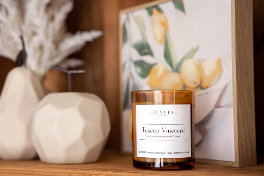 Signature Soy Candle Tuscan Vineyard in lifestyle image on shelf with candle as focal point. 