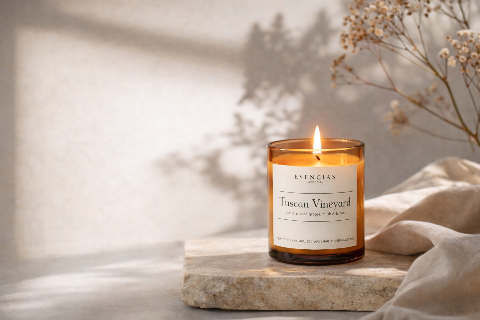 Lit candle on a stone surface with a soft background