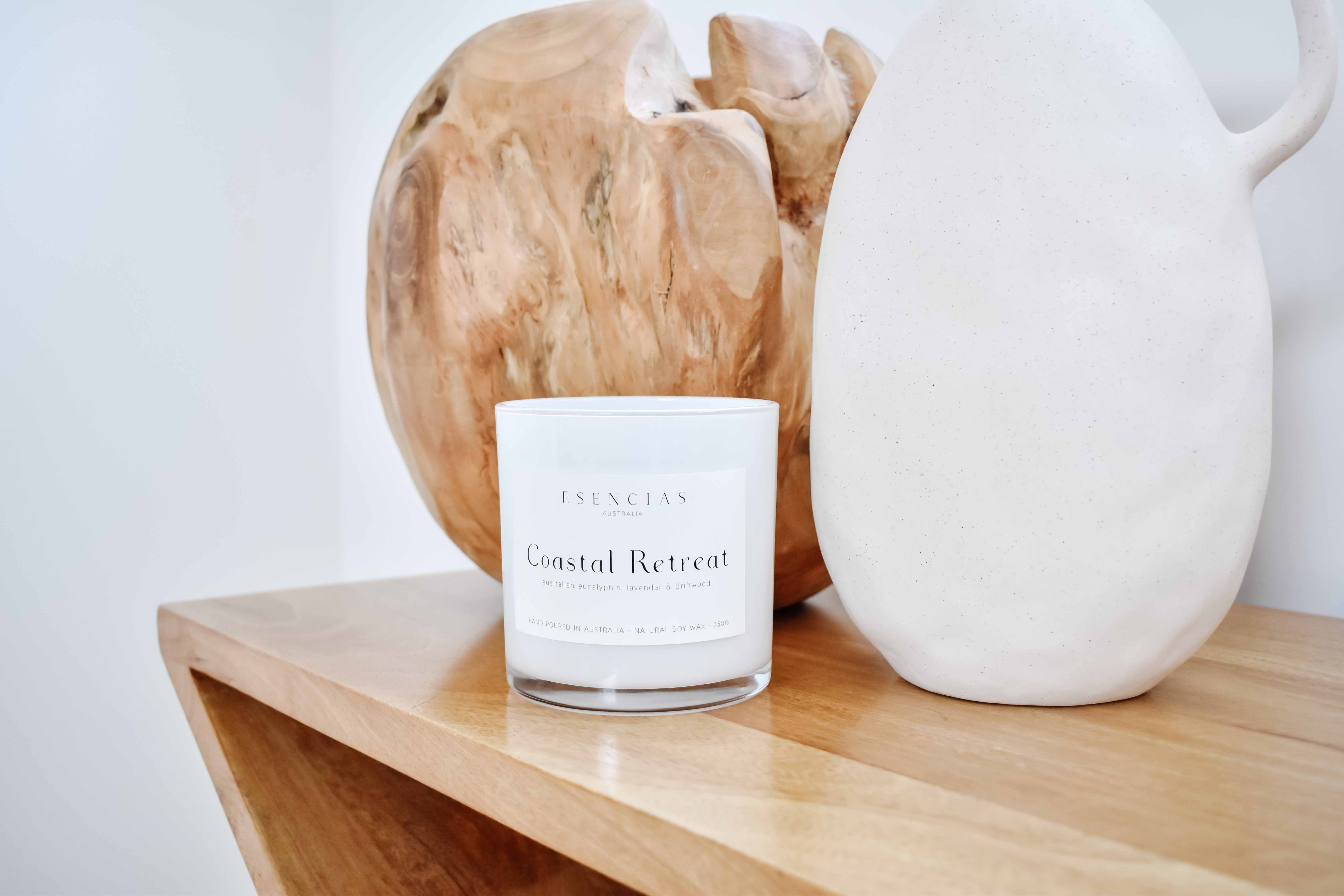 Coastal Retreat soy candle styled in a peaceful coastal lifestyle setting, evoking relaxation and ocean breeze serenity.
