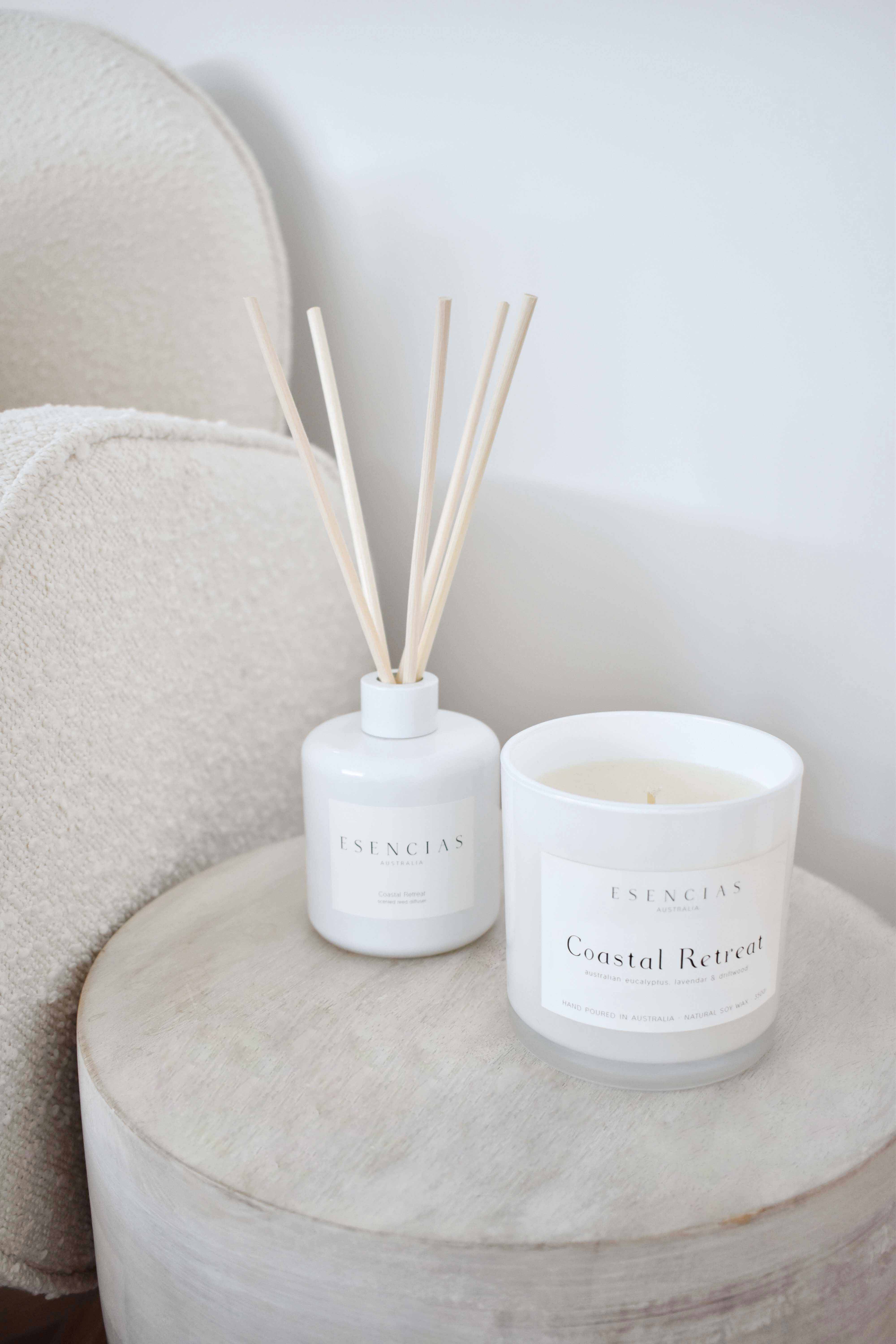 Coastal Retreat soy candle and reed diffuser styled together in a calming lifestyle setting, evoking a serene coastal atmosphere.