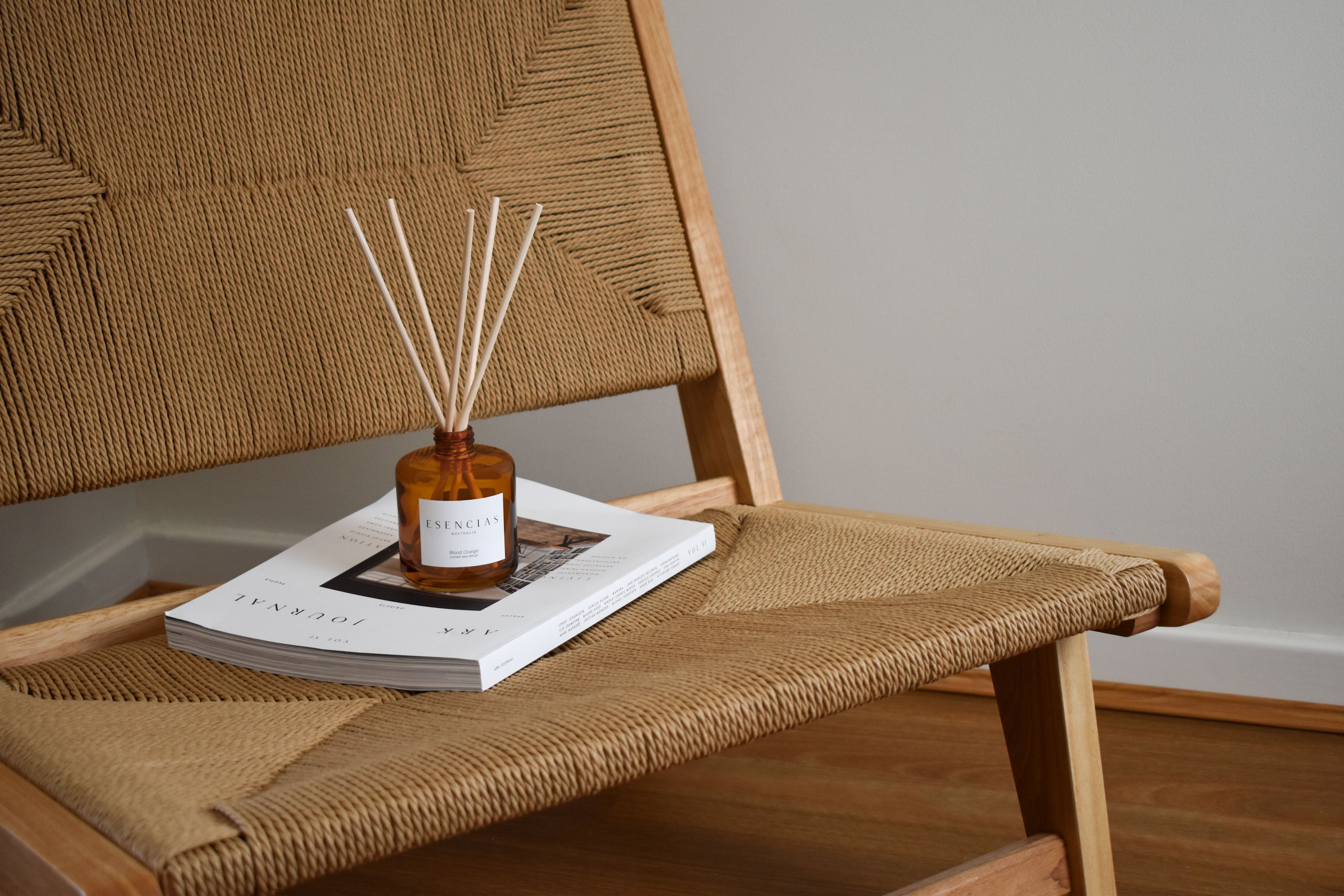 Esencias Blood Orange scented reed diffuser in amber glass jar