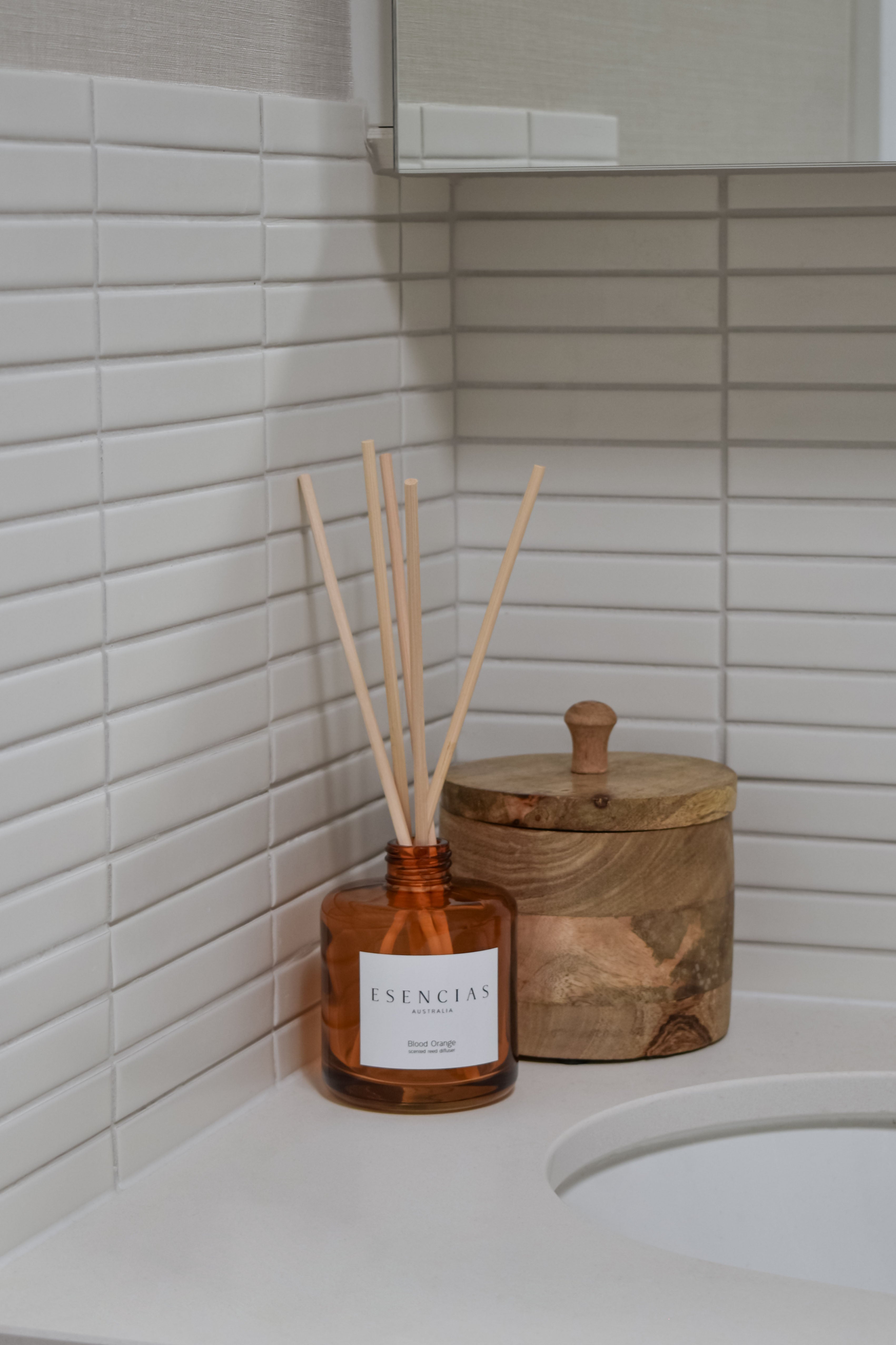 Esencias Blood Orange scented reed diffuser in amber glass jar