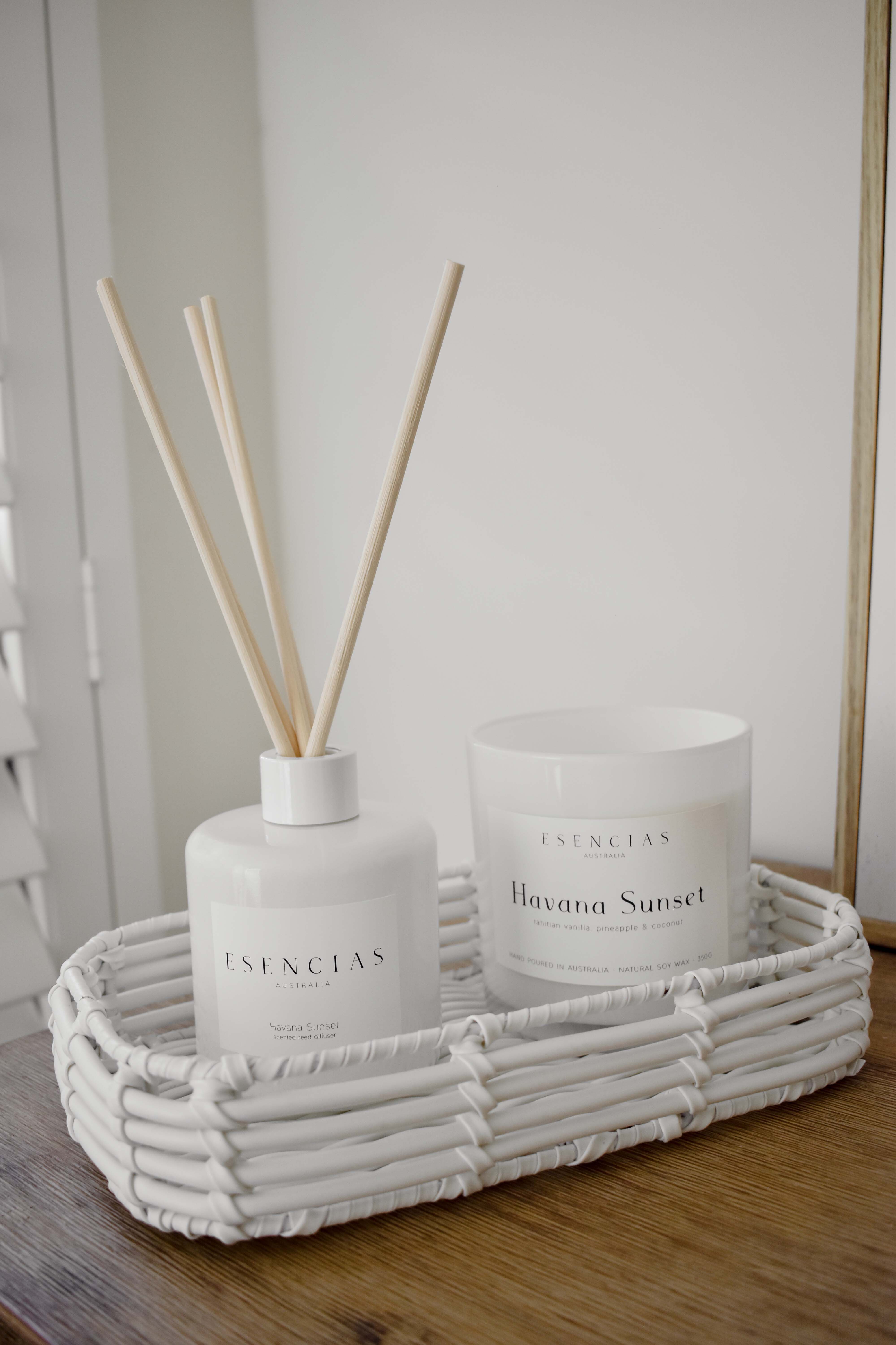 Havana Sunset coastal soy candle and reed diffuser styled in a relaxed lifestyle scene, capturing the warmth and energy of a coastal sunset.