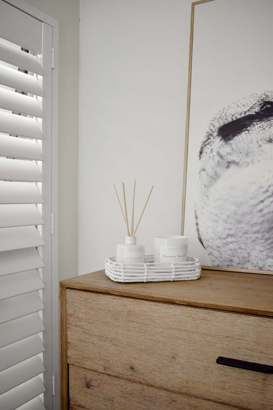 Havana Sunset Coastal Collection candle and reed diffuser styled in a bedroom lifestyle setting, evoking a serene, sun-kissed ambiance with coastal warmth.