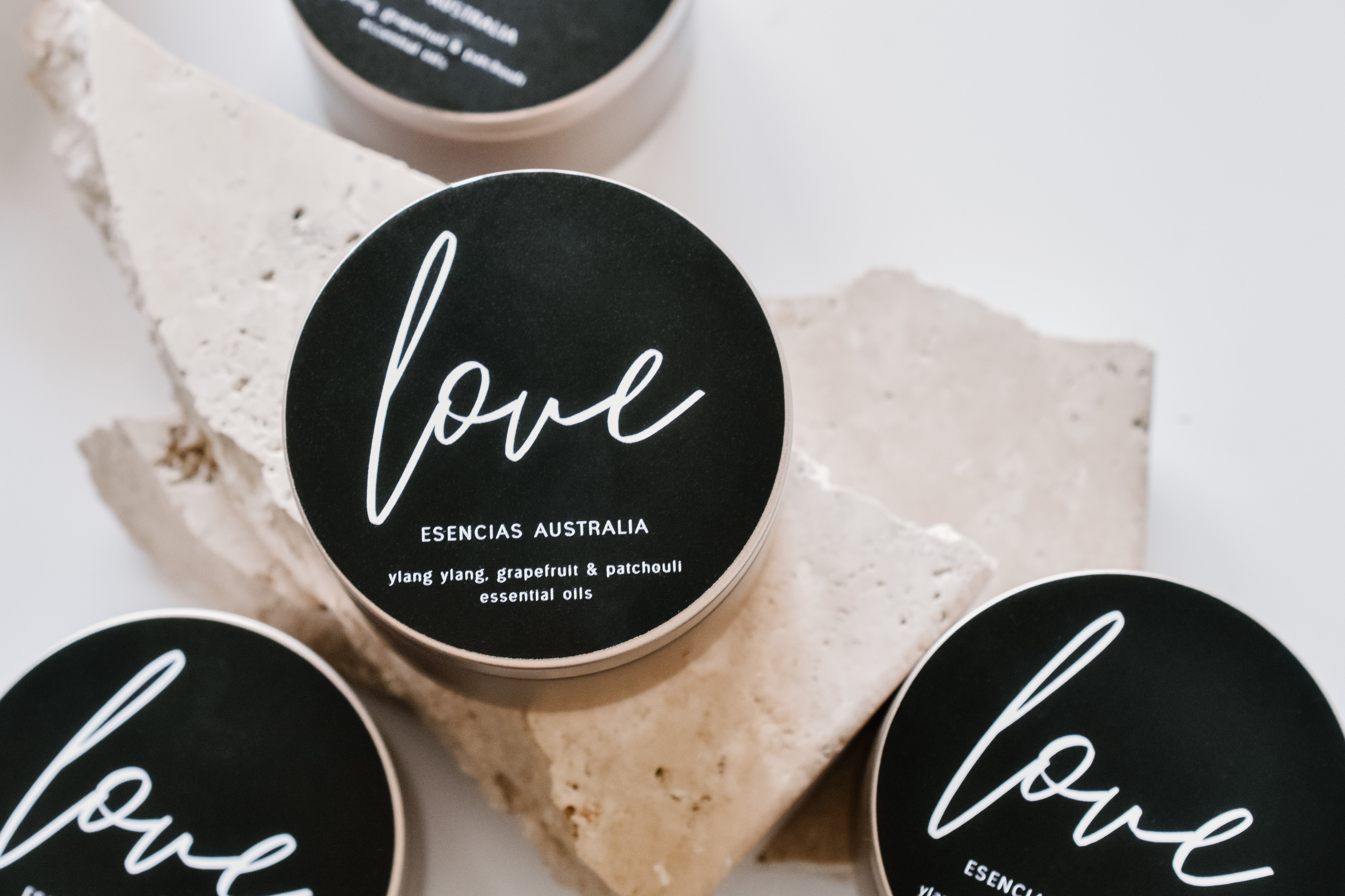 Multiple Love Edition candles displayed together in a product-focused image, showcasing their elegant design.