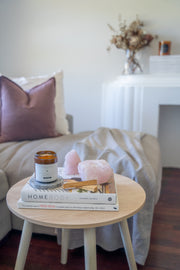 Love and Peace candle styled in a warm, inviting lifestyle setting, creating a serene and nurturing atmosphere.