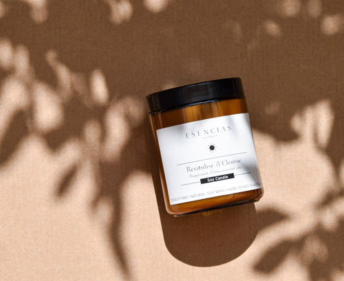Revitalise and Cleanse candle in a product-focused image with soft shadows, highlighting its clean design and energising presence.