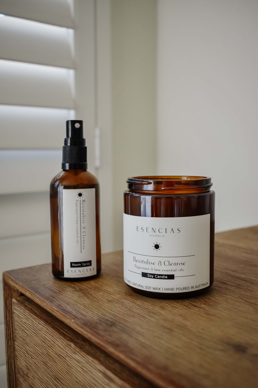 Revitalise and Cleanse candle and room spray styled in a lifestyle setting, evoking freshness, clarity and uplifting energy.