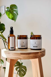 Revitalise and Cleanse candle, room spray and scrub displayed together in a product-focused image, highlighting their clean design and refreshing qualities.