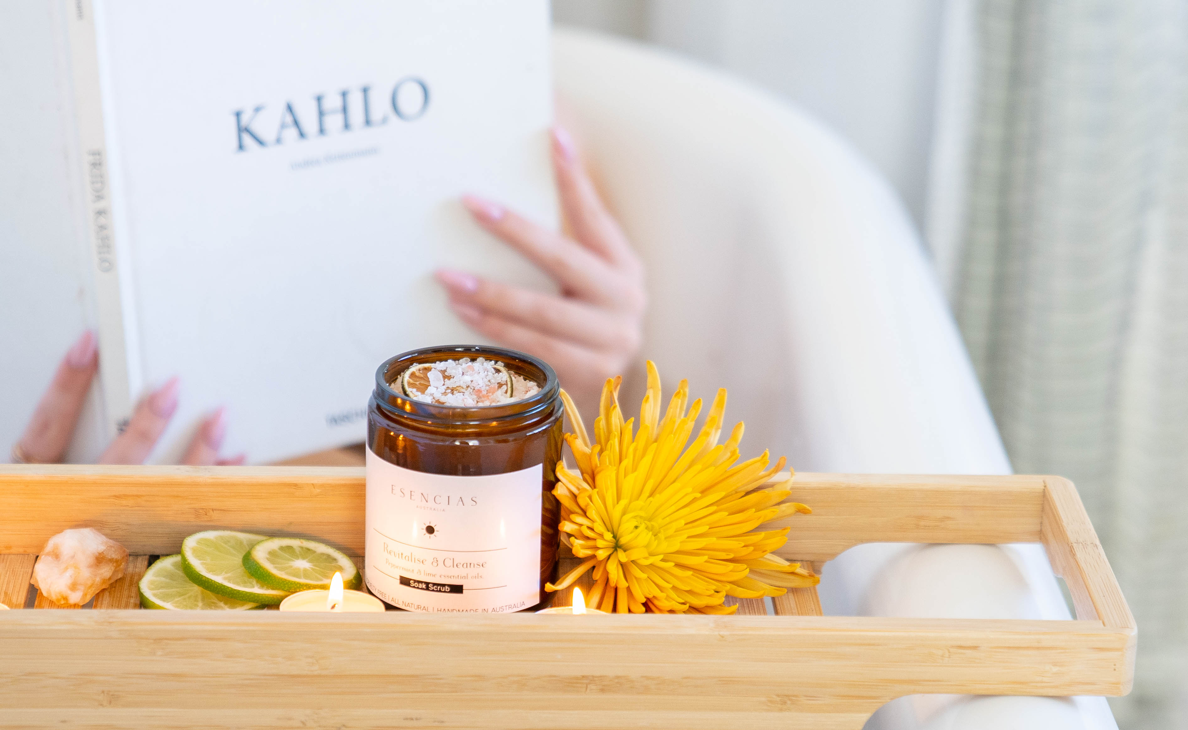 Revitalise and Cleanse scrub styled with model relaxing in bath, capturing a serene lifestyle moment of rejuvenation and self-nurturing.