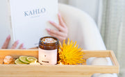 Revitalise and Cleanse scrub styled with model relaxing in bath, capturing a serene lifestyle moment of rejuvenation and self-nurturing.