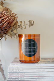 Tuscan Vineyard amber jar candle featured in a lifestyle scene, capturing a rich, inviting ambiance with rustic and elegant tones.