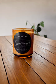 Tuscan Vineyard amber jar candle styled in a lifestyle setting, evoking rich warmth and elegant rustic charm.