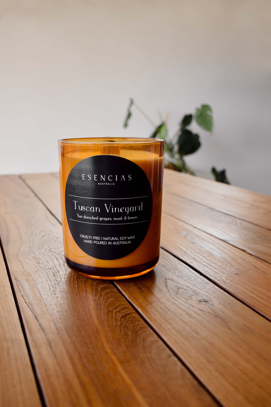 Tuscan Vineyard amber jar candle styled in a lifestyle setting, evoking rich warmth and elegant rustic charm.